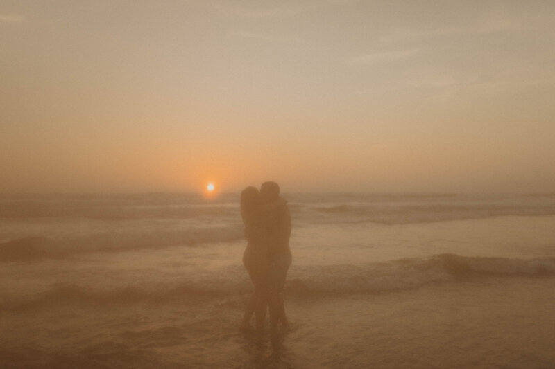 couple hugging at the beach