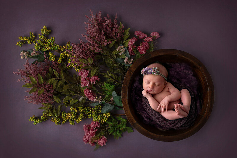 A gorgeous newborn baby in flower background