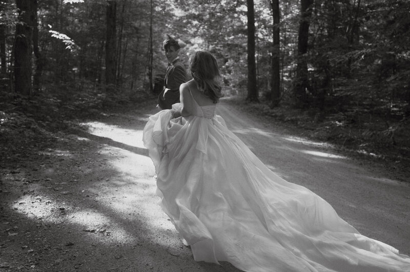 black and white photo of wedding couple in the woods