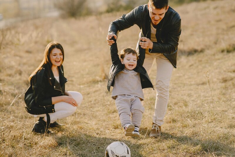 parents playing with son