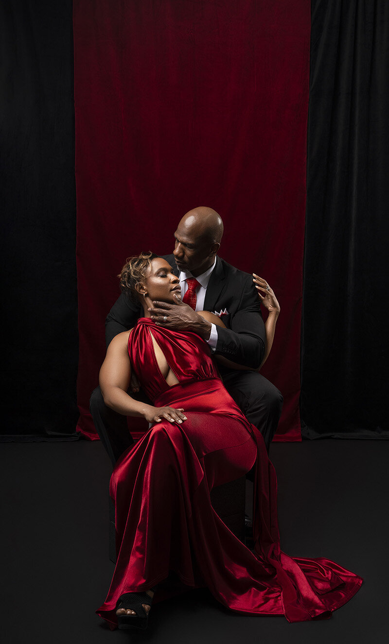 A couple laughs in engagement photos at Enid A. Haupt Garden