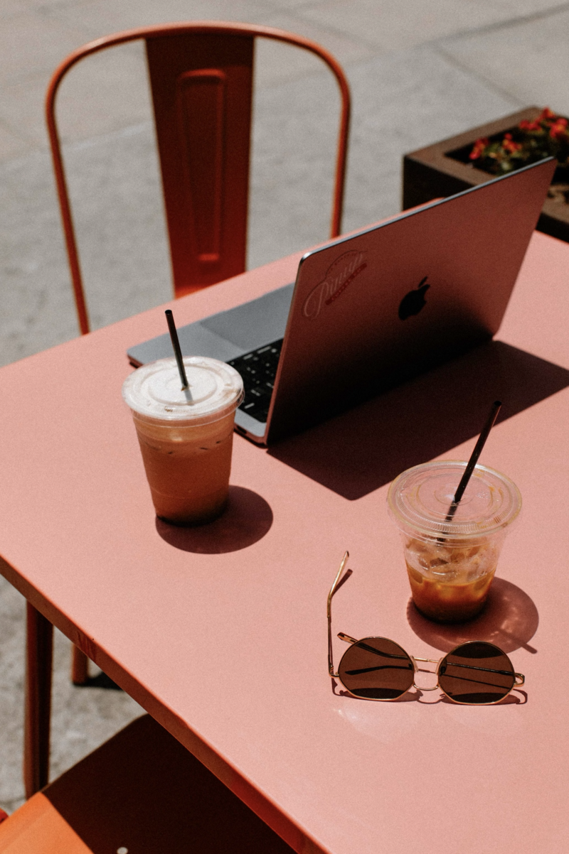 laptop sitting on table with coffee