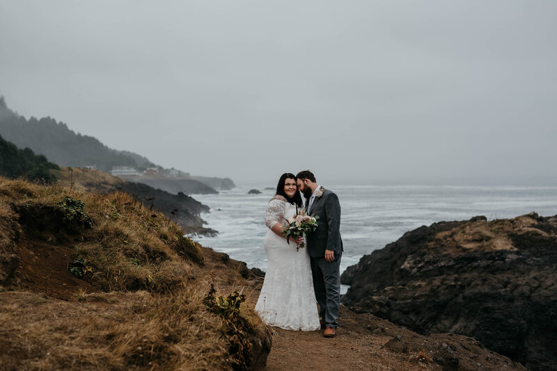 newlyweds on cliff