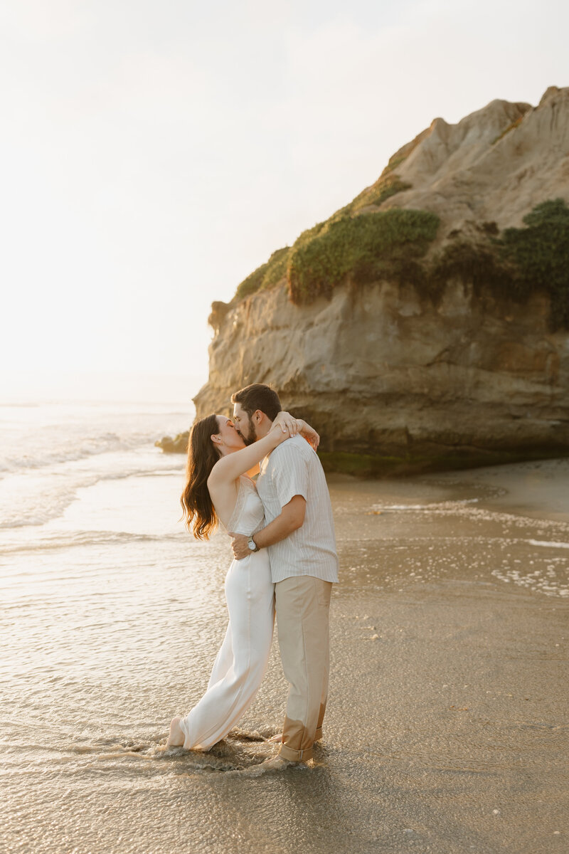 Couple kissing on the beach
