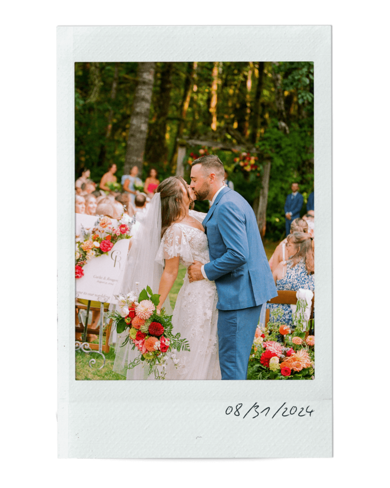 Polaroid of a bride and groom kissing at their outdoor ceremony, representing an wedding featured in the event planning portfolio. 