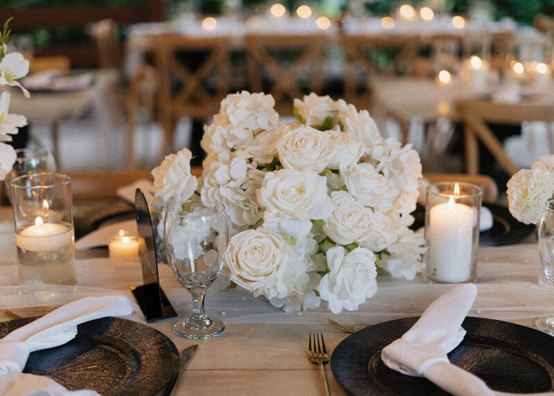 white flowers on a table at reception