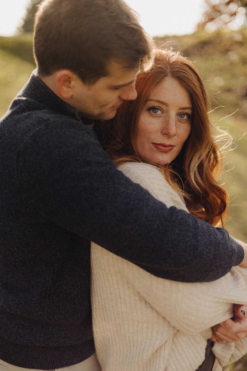 couple holding hands at wildcat creek reservoir park for engagement session