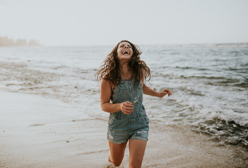 girl running by the ocean