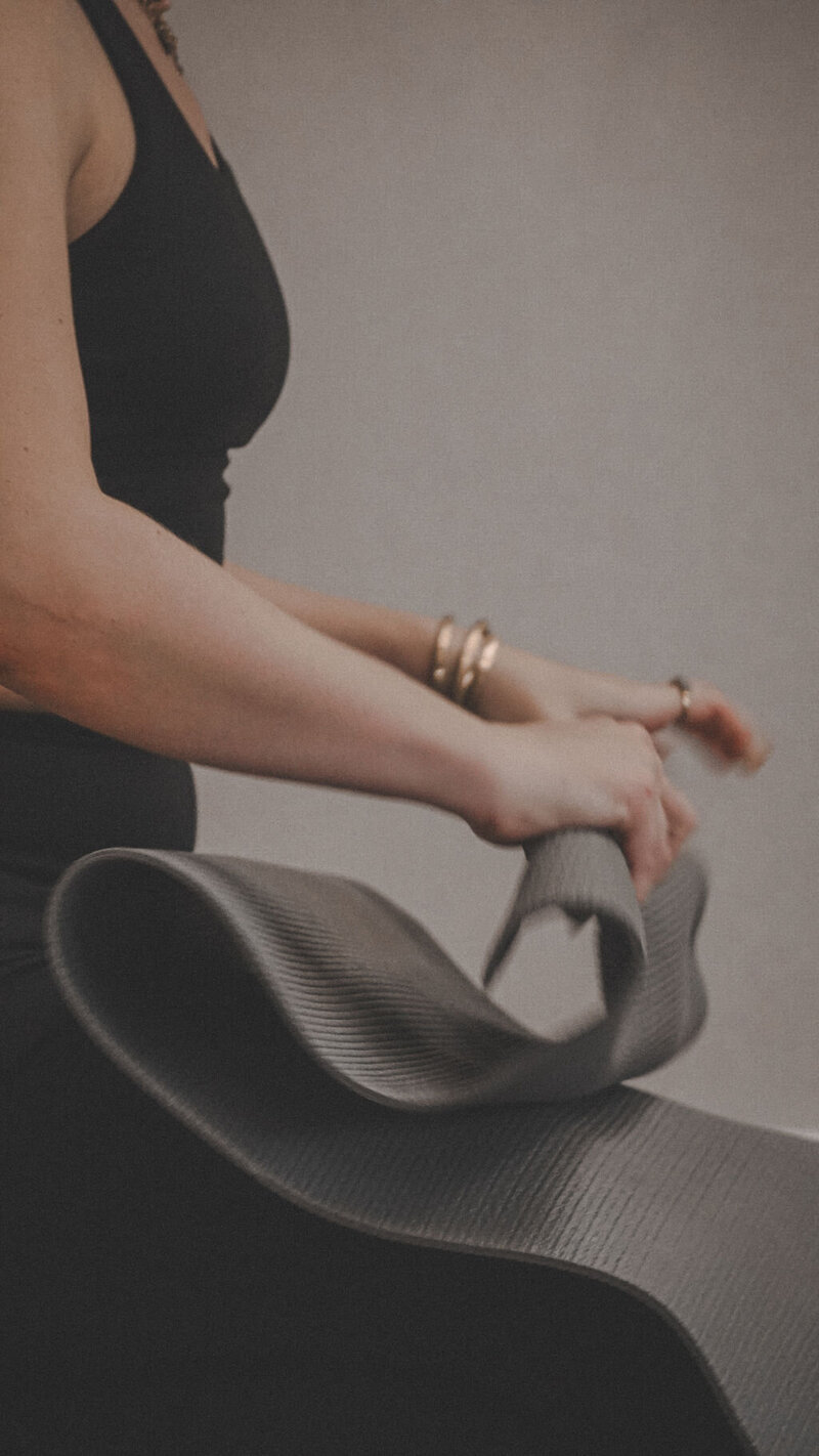 Client doing yoga poses to enhance flexibility and joint health as part of holistic recovery