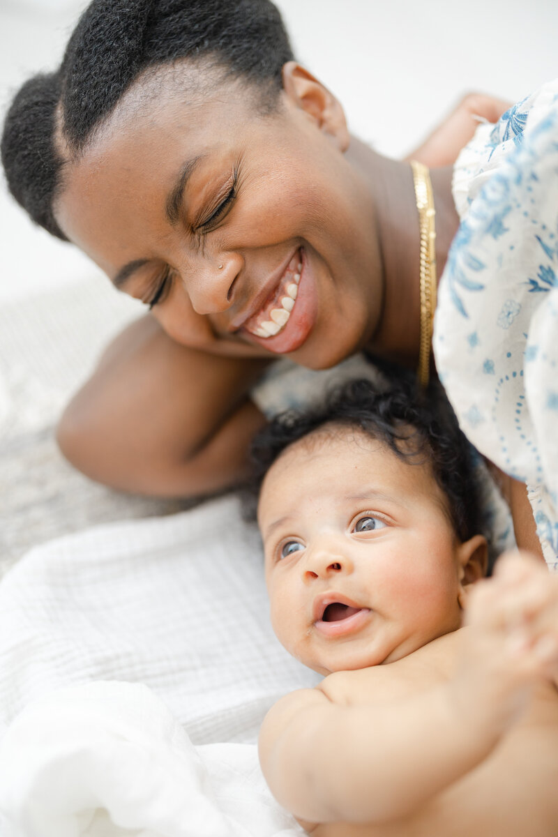 Mother smiles with her baby