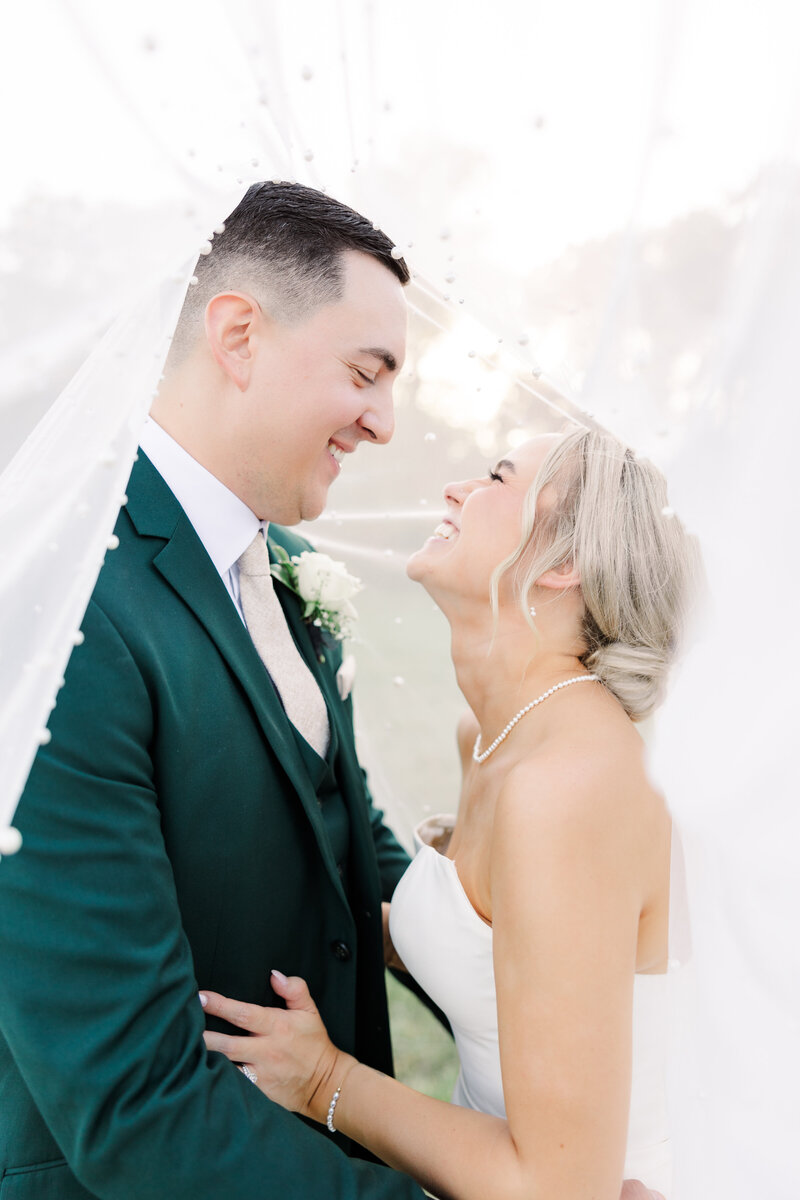 bride and groom laughing taken by mn wedding photographer