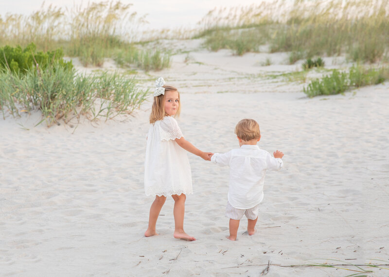 newborn baby girl photographed in a grandmillenial style in south georgia in a pink feltman brothers dress
