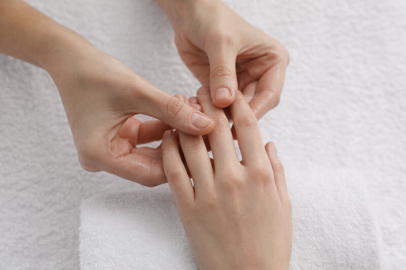 Close-up of a relaxing hand massage focusing on fingers, ideal for sensory calming or ASMR-inspired touch.