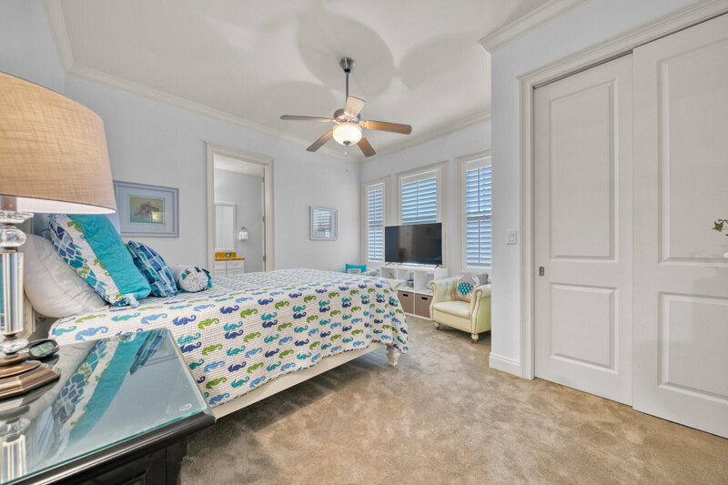 bedroom with queen bed and sitting chair
