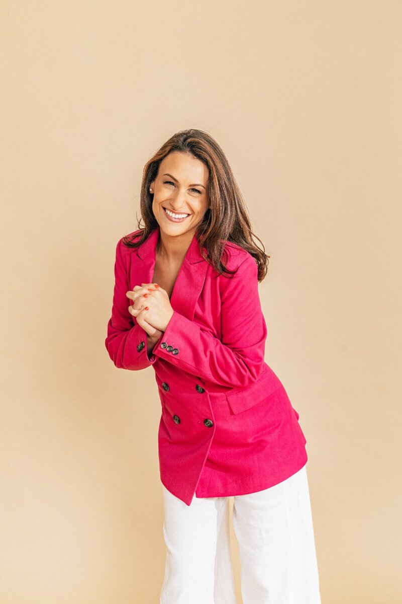 Julia Korn in Pick Jacket Hands Clasped
