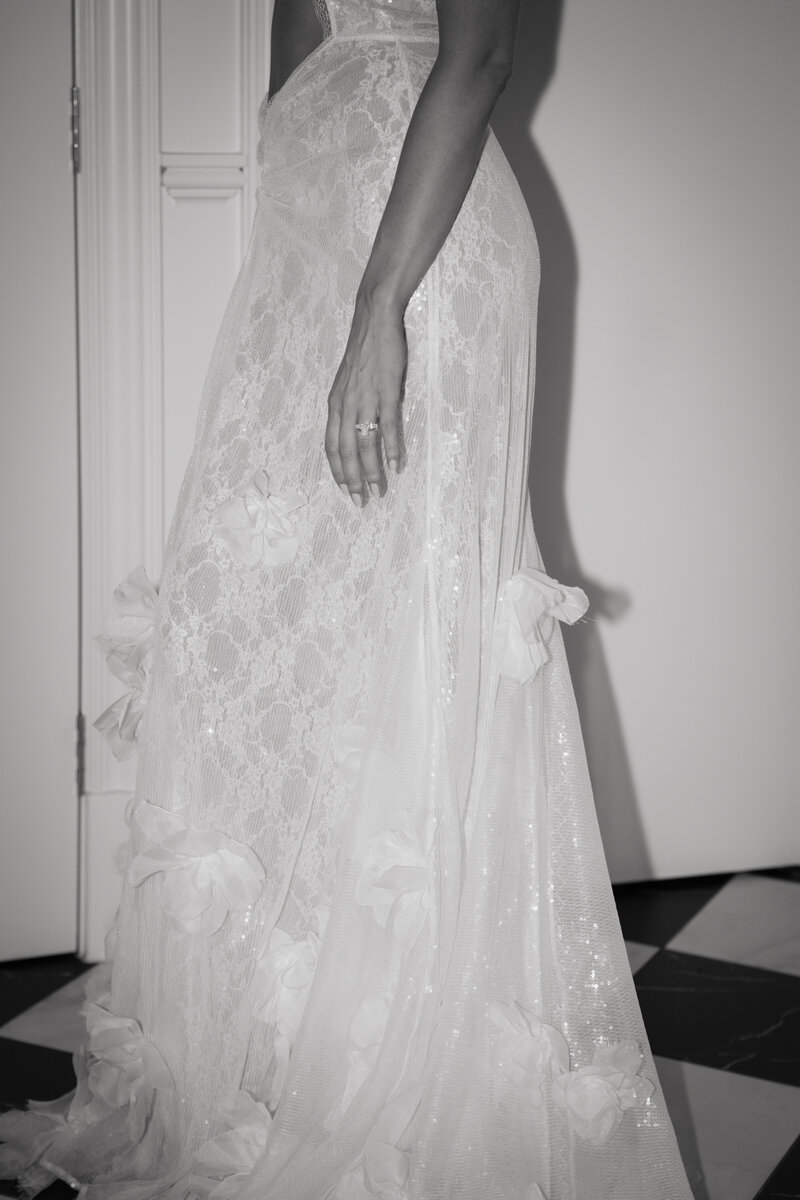 Bride detail black and white shot with engagement ring