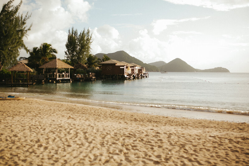 Gorgeous overwater bungalows sit among the serene turquoise waters in St. Lucia. 