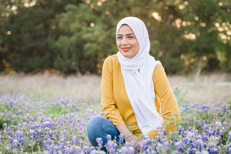 Woman with head wrap in field of bluebonnets, Austin Family Photographer