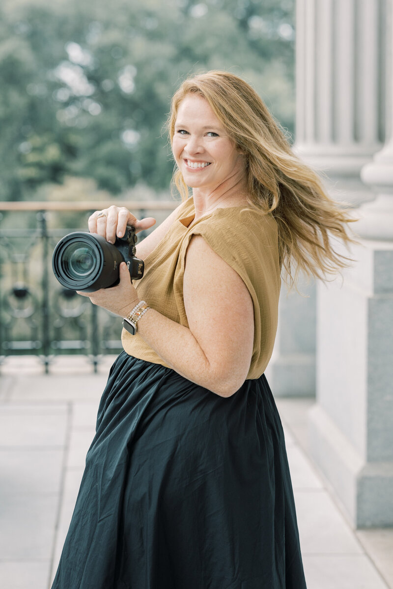Charleston Wedding Photographer | Photographer holding a camera spinning around