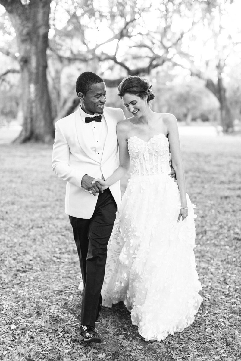 groom and bride standing together in forest background in Chicago