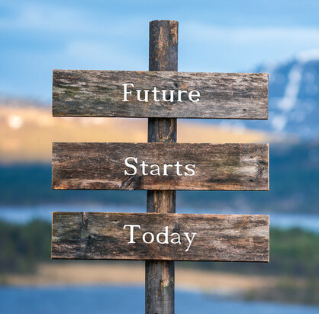a signpost in a mountainous scene that says Future Starts Today