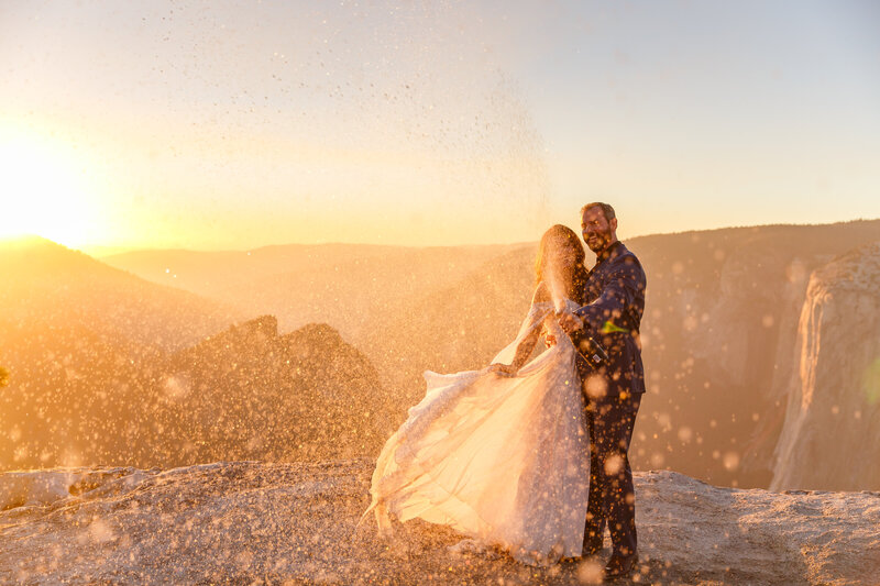 This couple eloped at Taft Point in Yosemite and celebrated with a champaign spray.