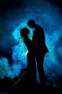Romantic wedding couple silhouette with dramatic blue smoke lighting by professional St Augustine wedding photographer