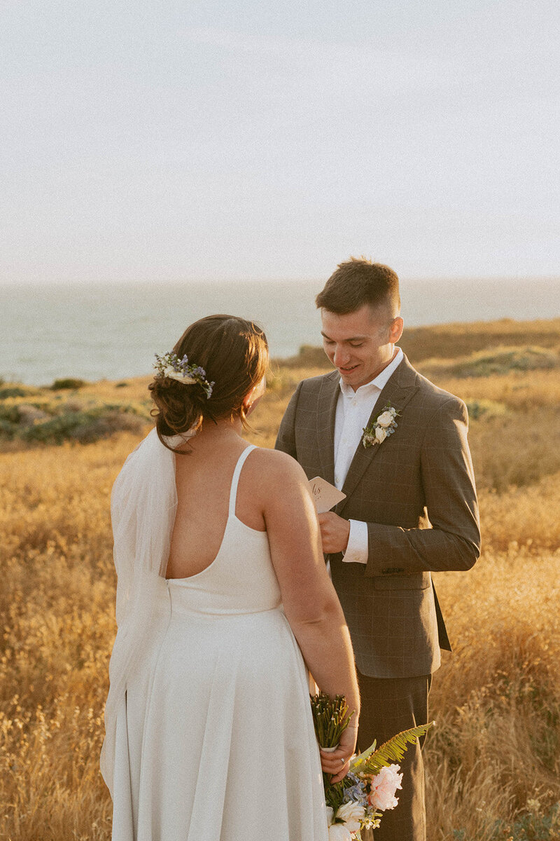 couple hugging in forest during their wedding day