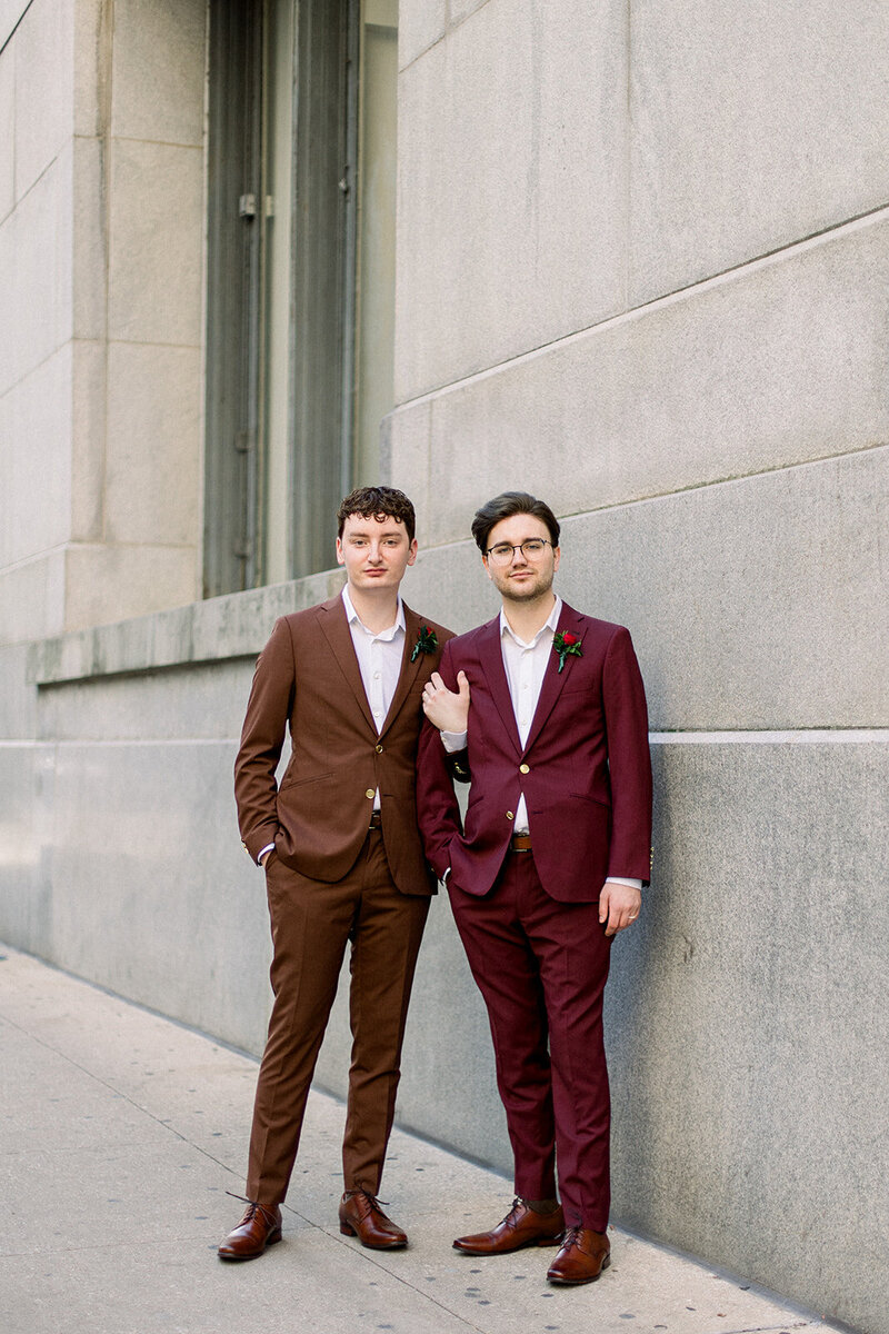 portrait of two grooms at city hall