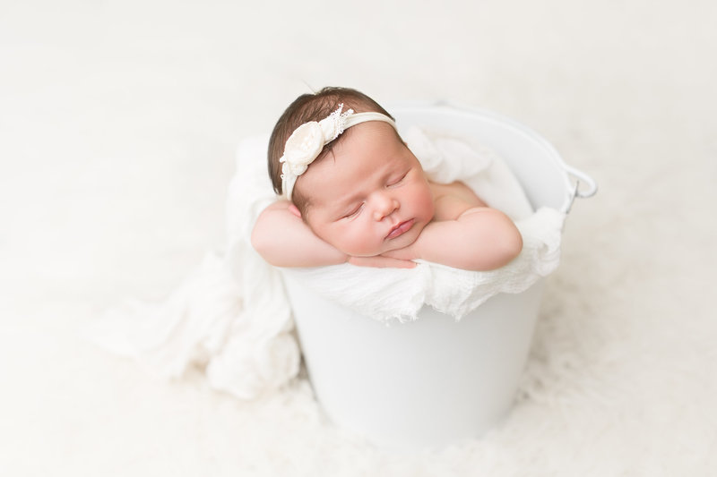 Baby Girl in White Bucket
