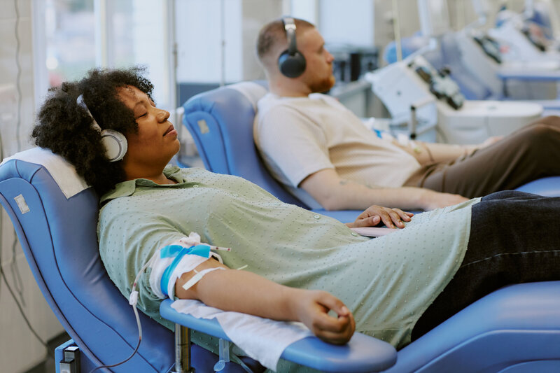donating-blood-in-medical-facility-with-relaxed-at-2024-11-01-17-05-53-utc