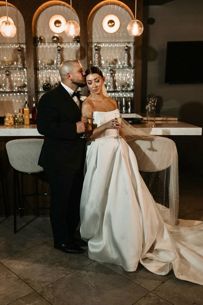 A Houston bride-to-be receiving a personalized bridal beauty consultation from an expert Houston makeup artist in a chic studio.