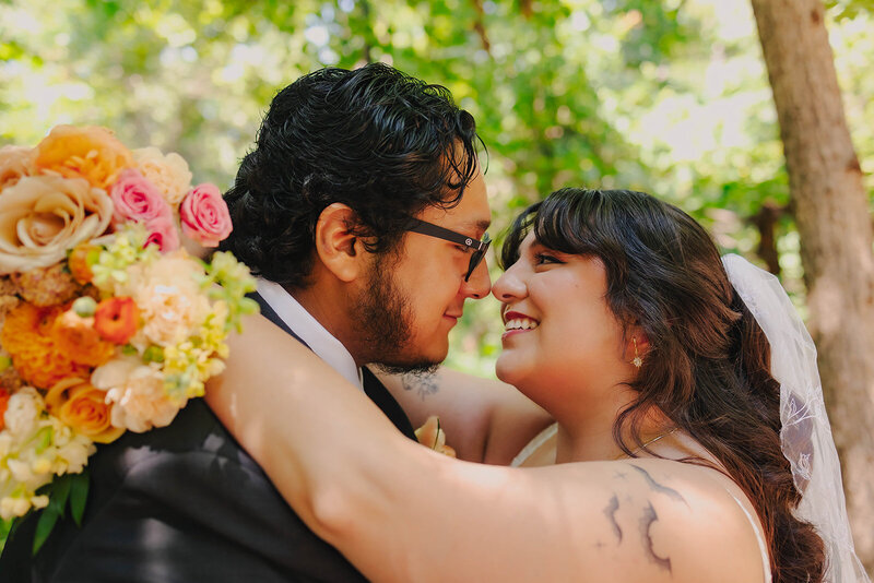 bride and groom embrace at dallas texas wedding
