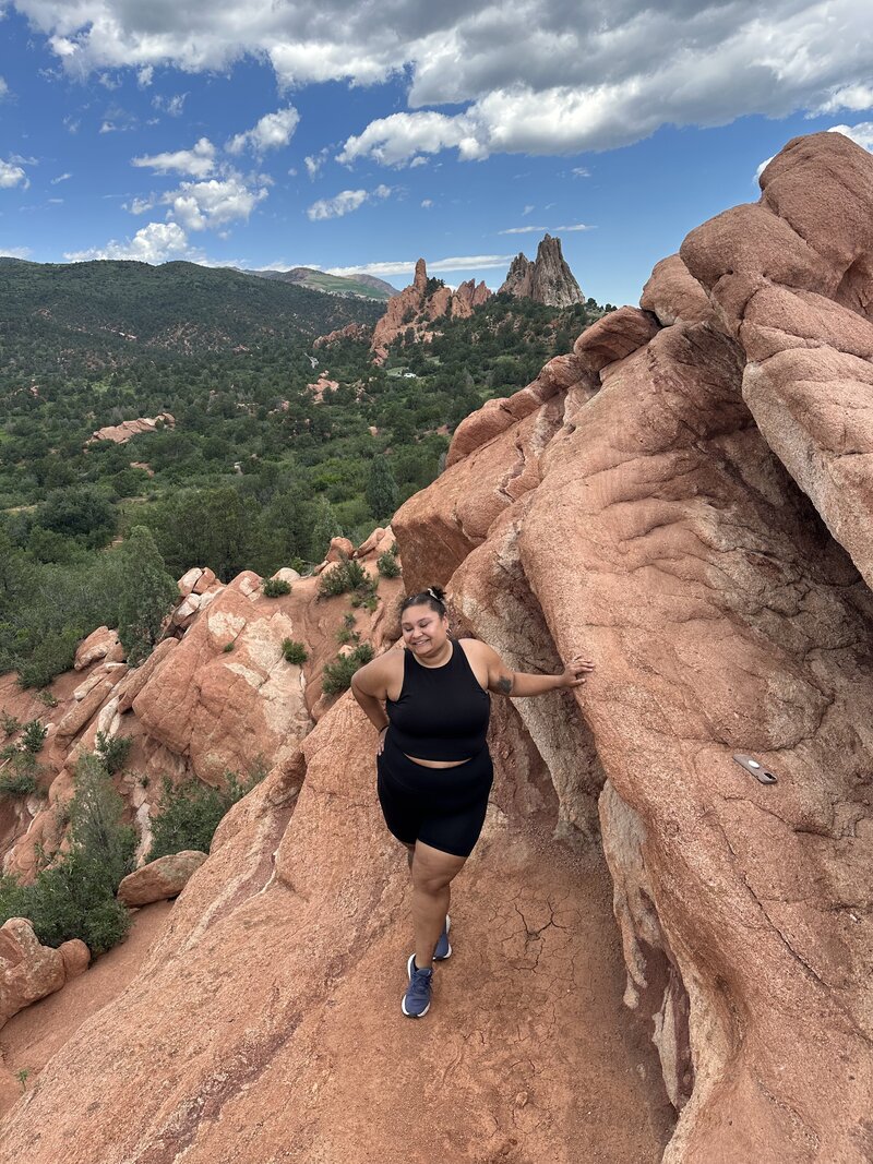 Destination elopement photographer Ashley exploring Colorado at the Garden of Gods.