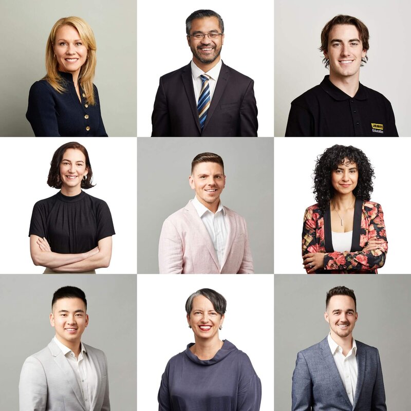 9 different headshots of corporate people against plain backgrounds shot in studio.