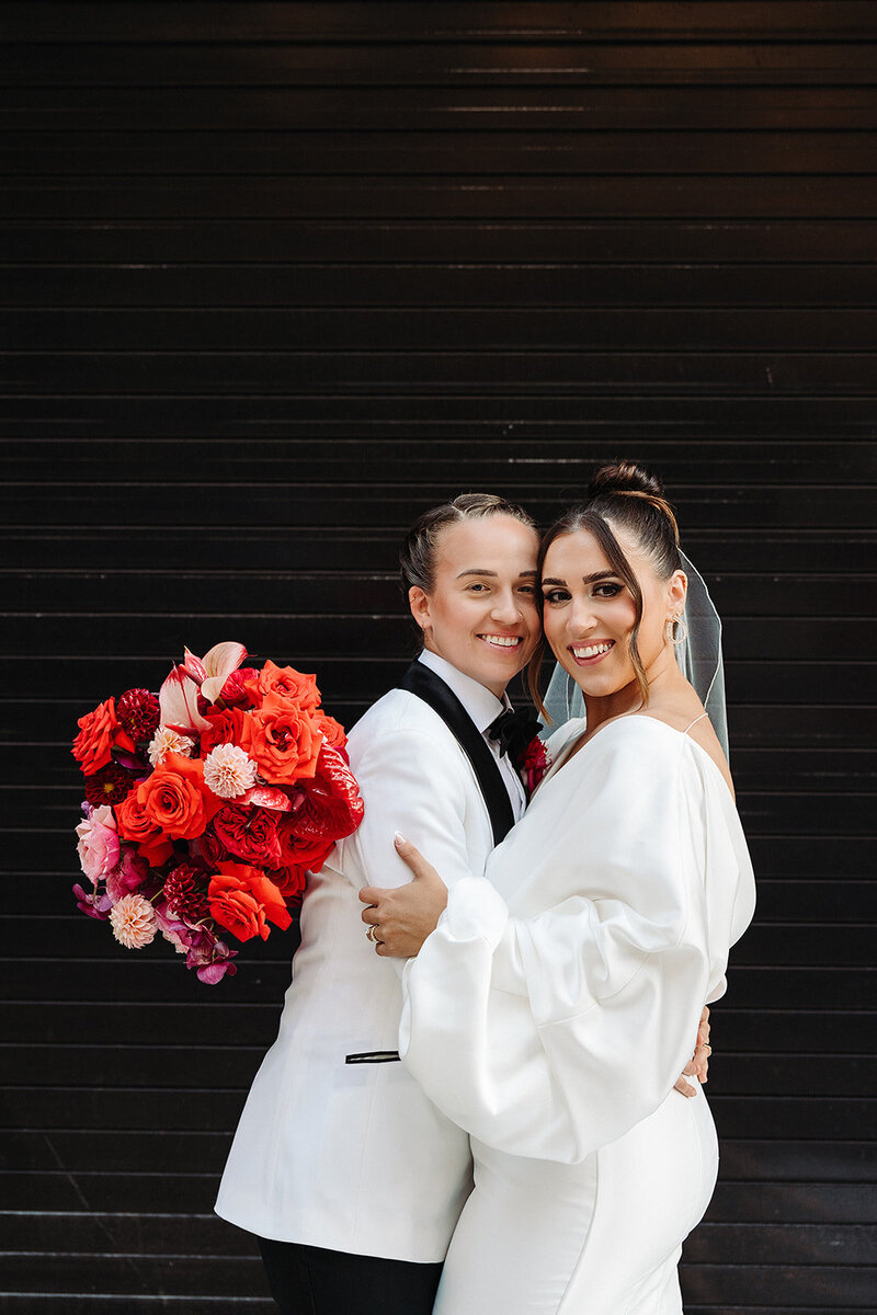 LGBTQ couple at Riley Building wedding planned by Bianca Nichole and Co