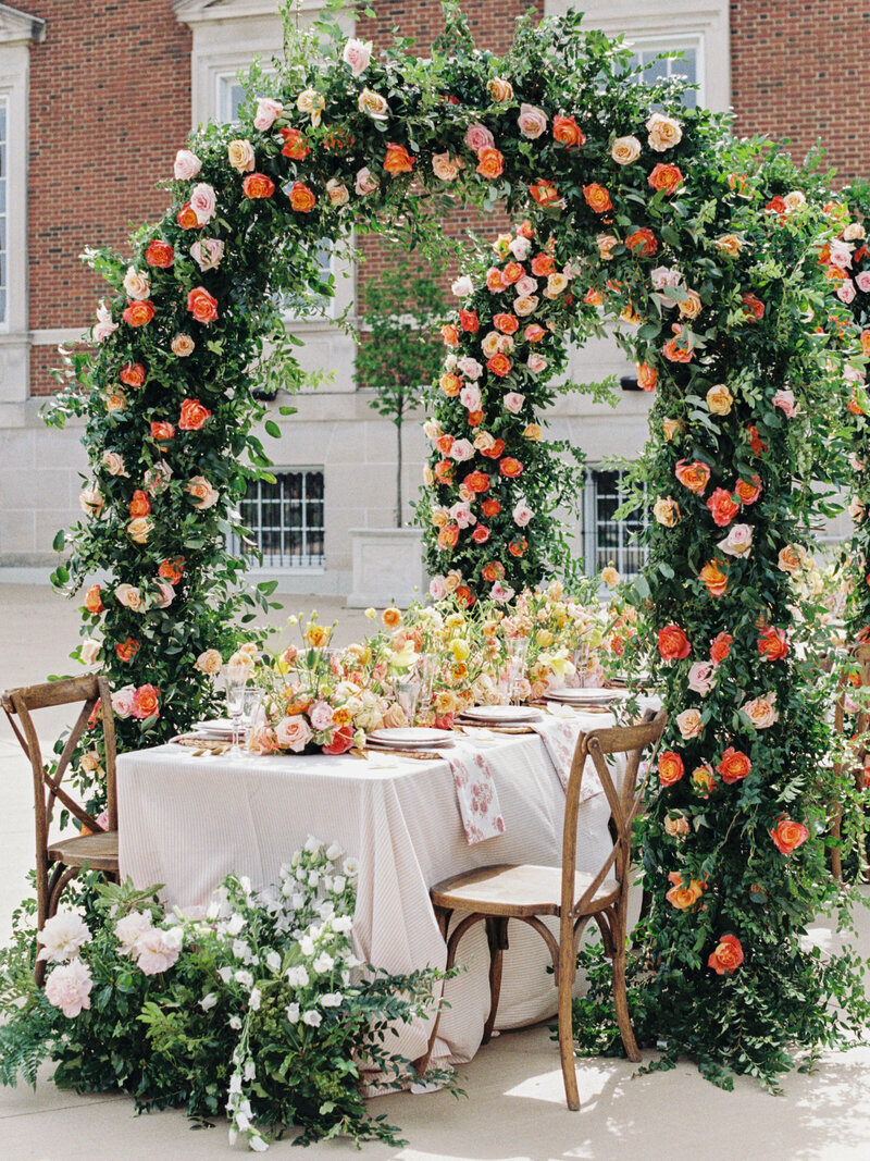 Chicago History Museum reception decor featuring flowered arches photographed with film