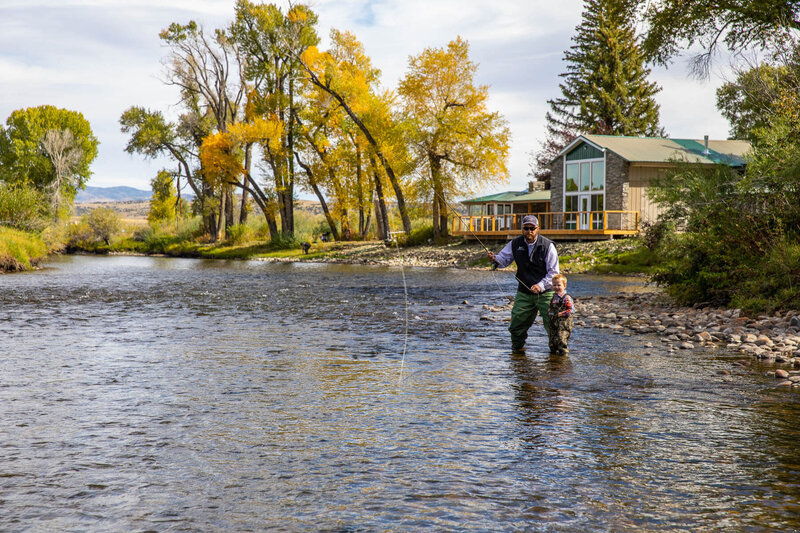 Father and son fly fishing at Elk Hollow in Saratoga, WY
