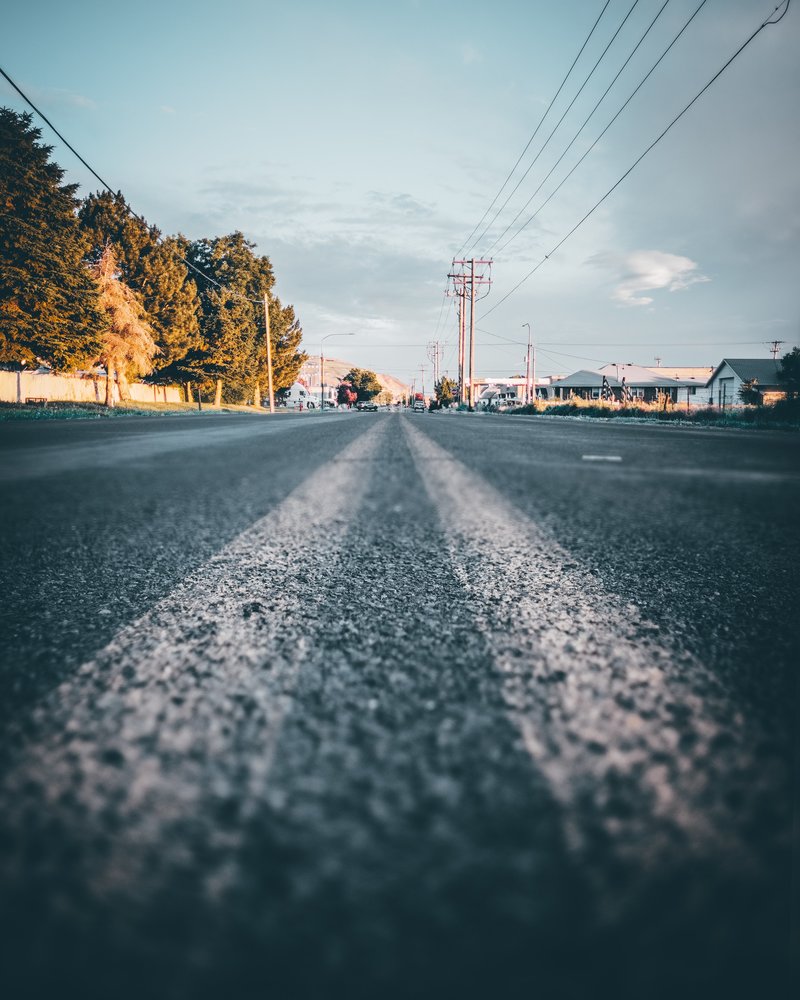 Detailed image of asphalt road representing details of terms and conditions for website use