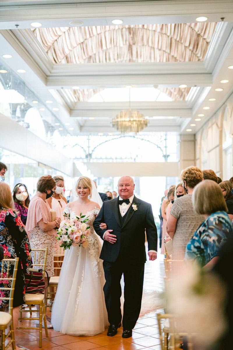Swank Soiree Dallas Wedding Planner Lauren and Ashton at the Crescent Hotel - walking down the aisle
