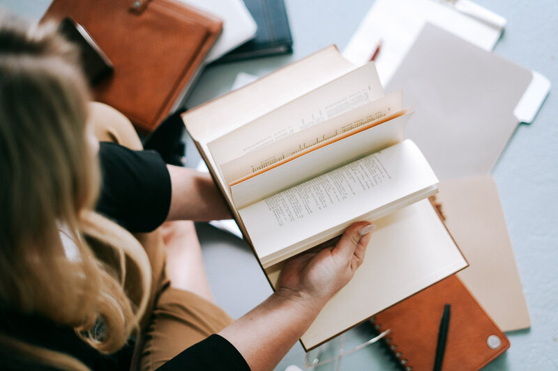 Lawyer flips through pages of law book