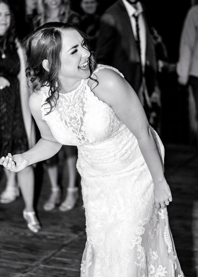 couple holding hands on the dance floor at all-inclusive wedding venue