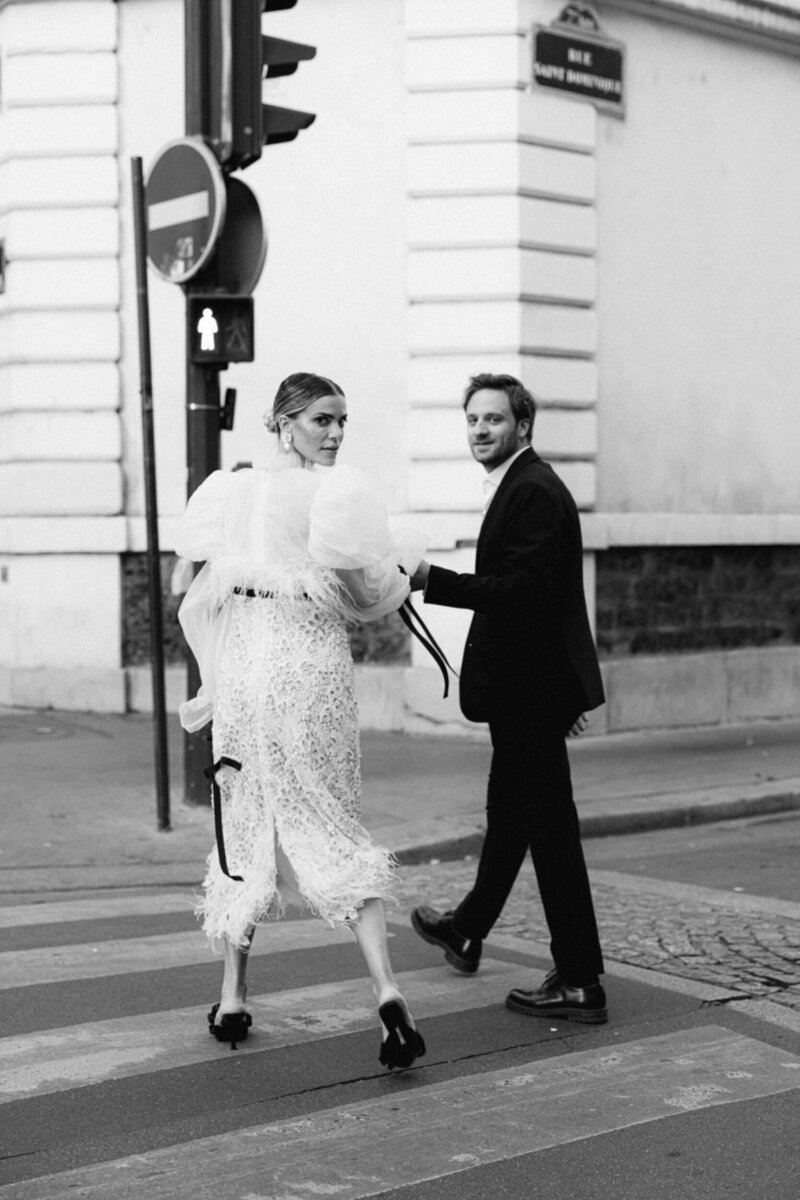 A wedding photo of the couple in the streets of Paris France