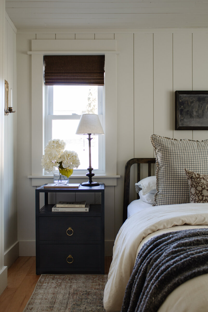 Primary bedroom renovation by Nadine Stay. Vertical  wood plank walls and wood plank ceiling. Low bedroom ceiling before and after.