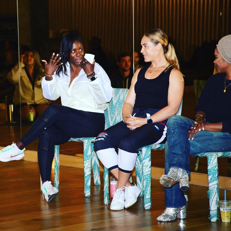 a group of women engaged in a conversation at a workshop