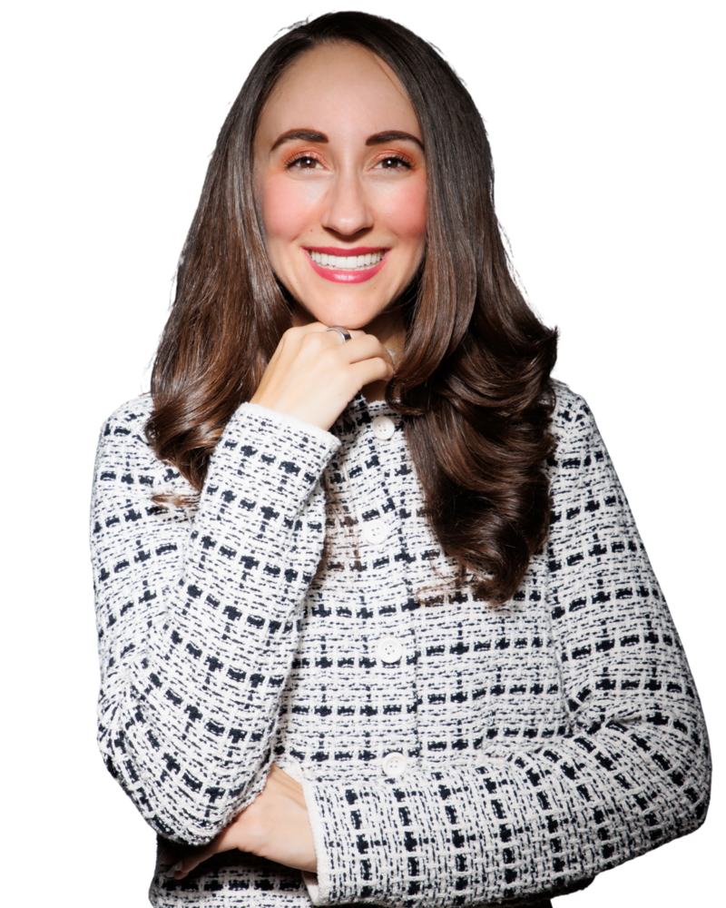 Corinne Goldberg in a white and black blazer, smiling confidently
