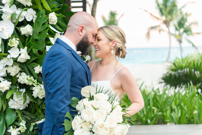 bride and groom touching noses