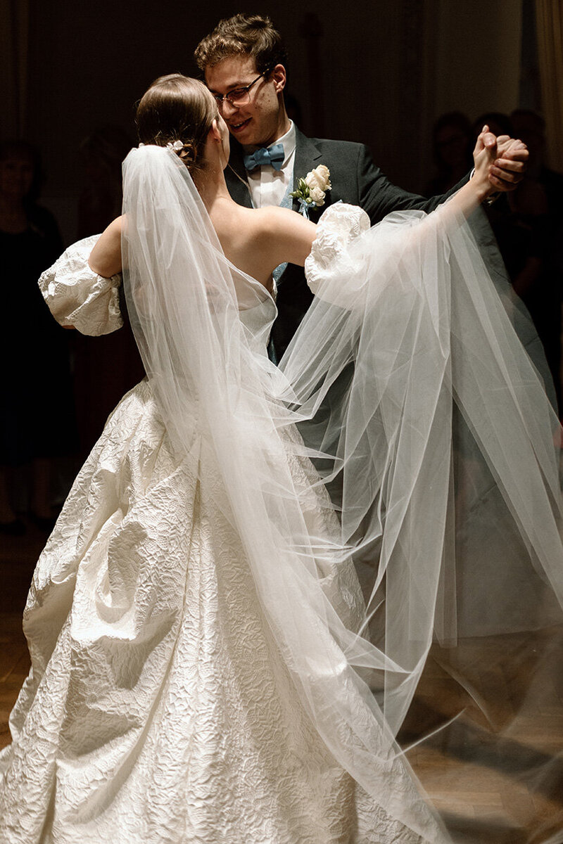 Luxury wedding in Europe – sophisticated bride in a modern wedding gown and groom in a timeless suit.