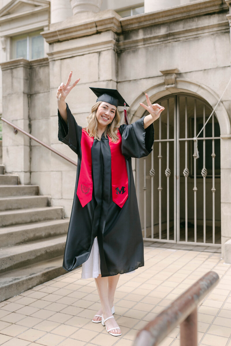 girl smiling with graduation hat during senior photoshoot