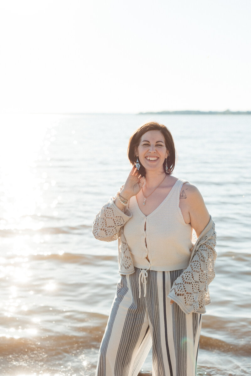 A solo branding photography session with great lighting and a background of the sea